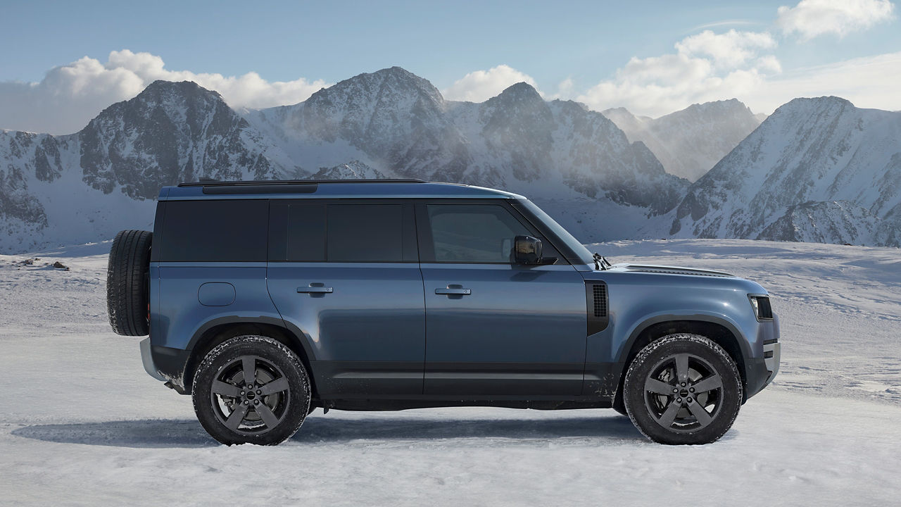 Defender on snow road