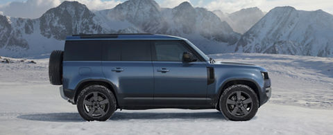 Defender on snow road