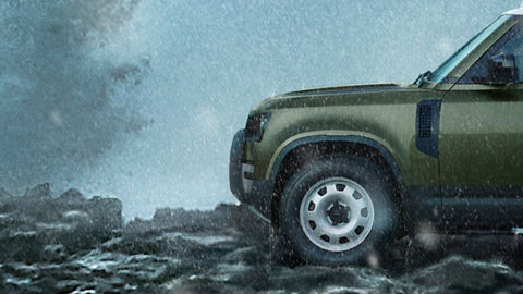 Defender on Mountain surrounded with water
