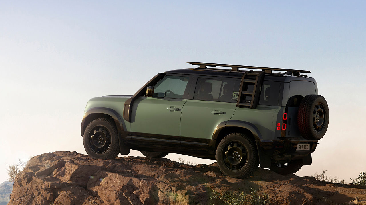 Defender parked on edge of the hill
