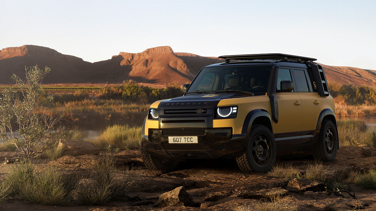 Defender parked on hill road
