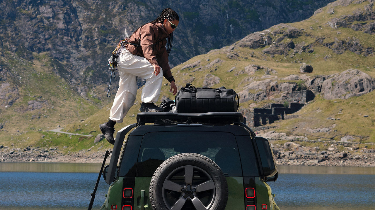 Women on top of defender 