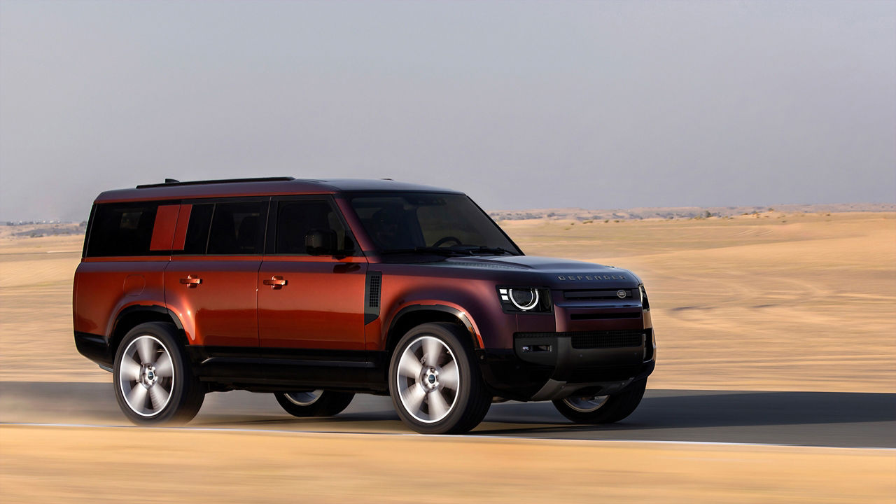 Defender parked in desert 