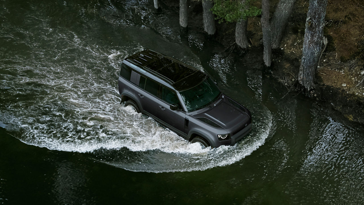 Defender sailing in water top view