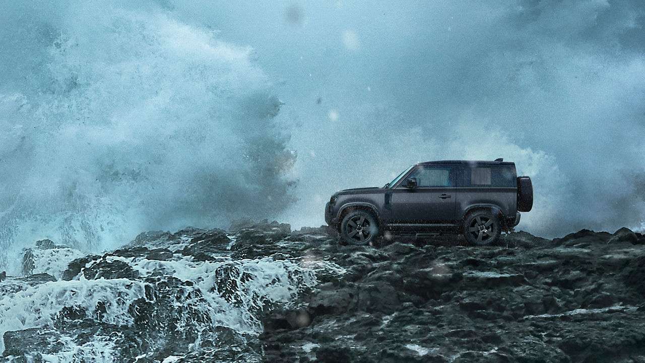 Defender on Mountain surrounded with water
