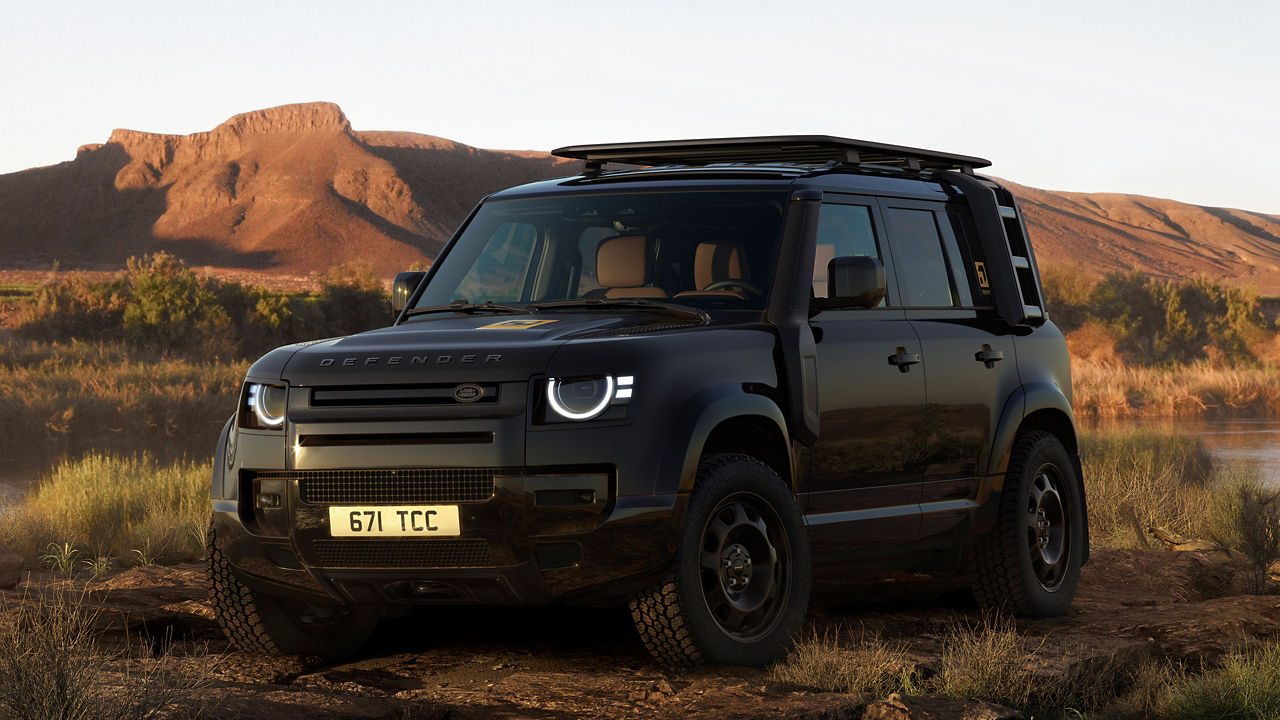 Defender parked on hill road
