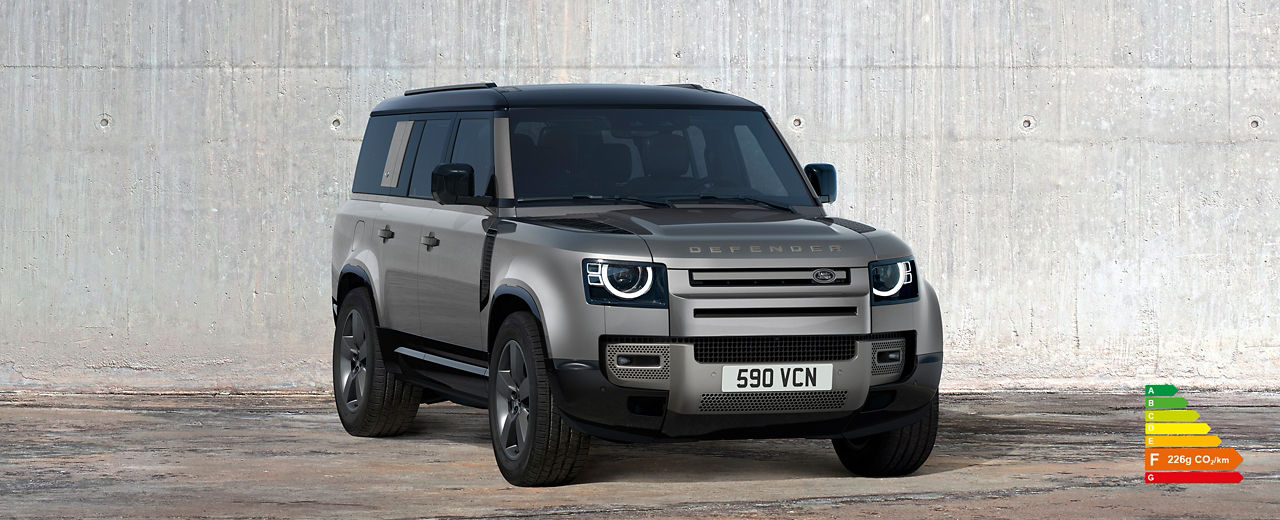 Defender 130 parked outside with energy efficiency label F (226g CO2/km).