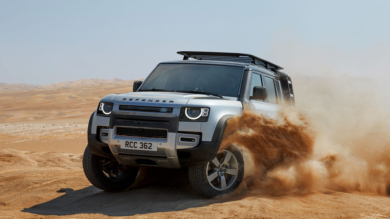 Defender Drifting Over Sand Dust Road