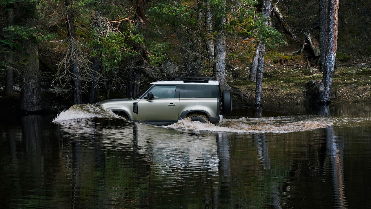 Defender Driving Through Water