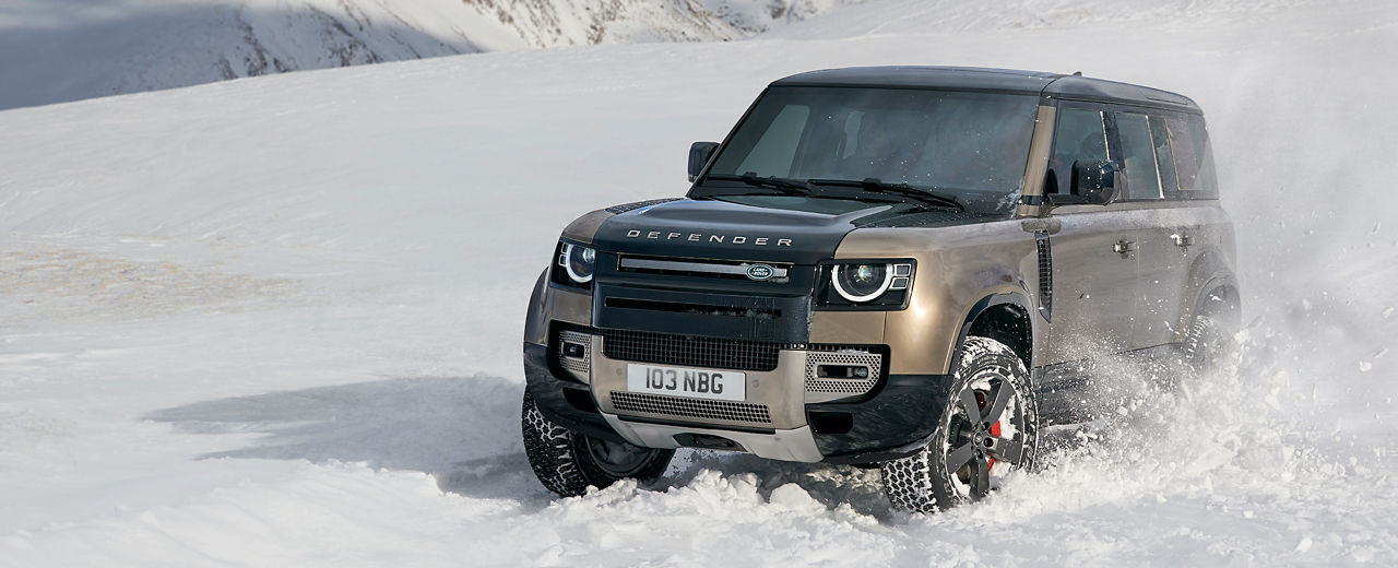 Defender drifting over muddy off road