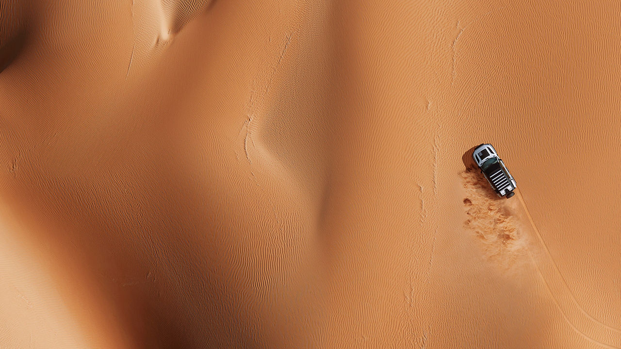 Top View of Car Drifting Over Sand Dust Road