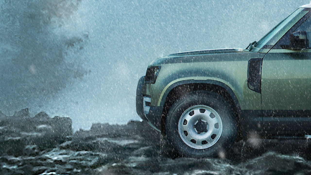 Defender on Mountain surrounded with water