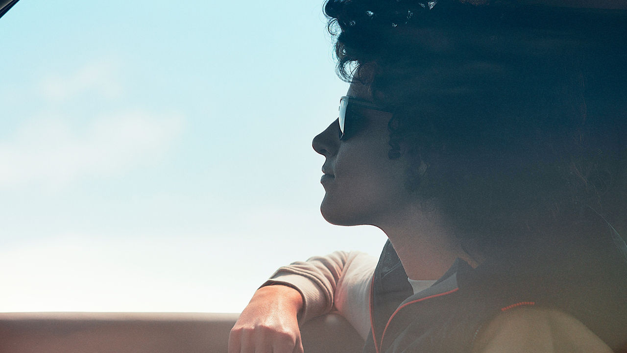 Woman looking outside From Defender window 