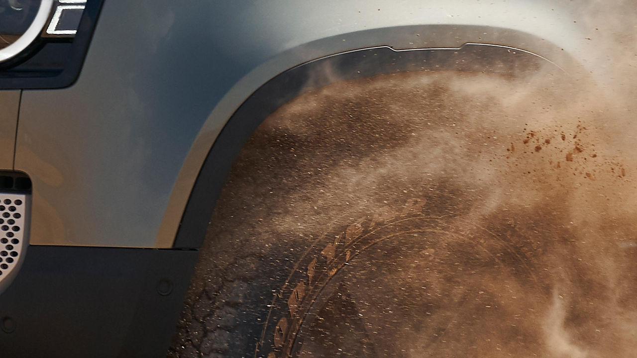 Defender Off-Roading in the Desert, wheel close-up