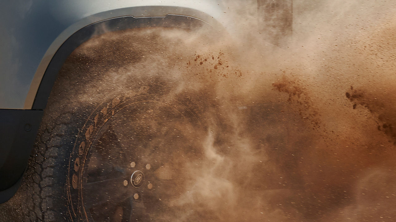 Defender Off-Roading in the Desert, wheel close-up