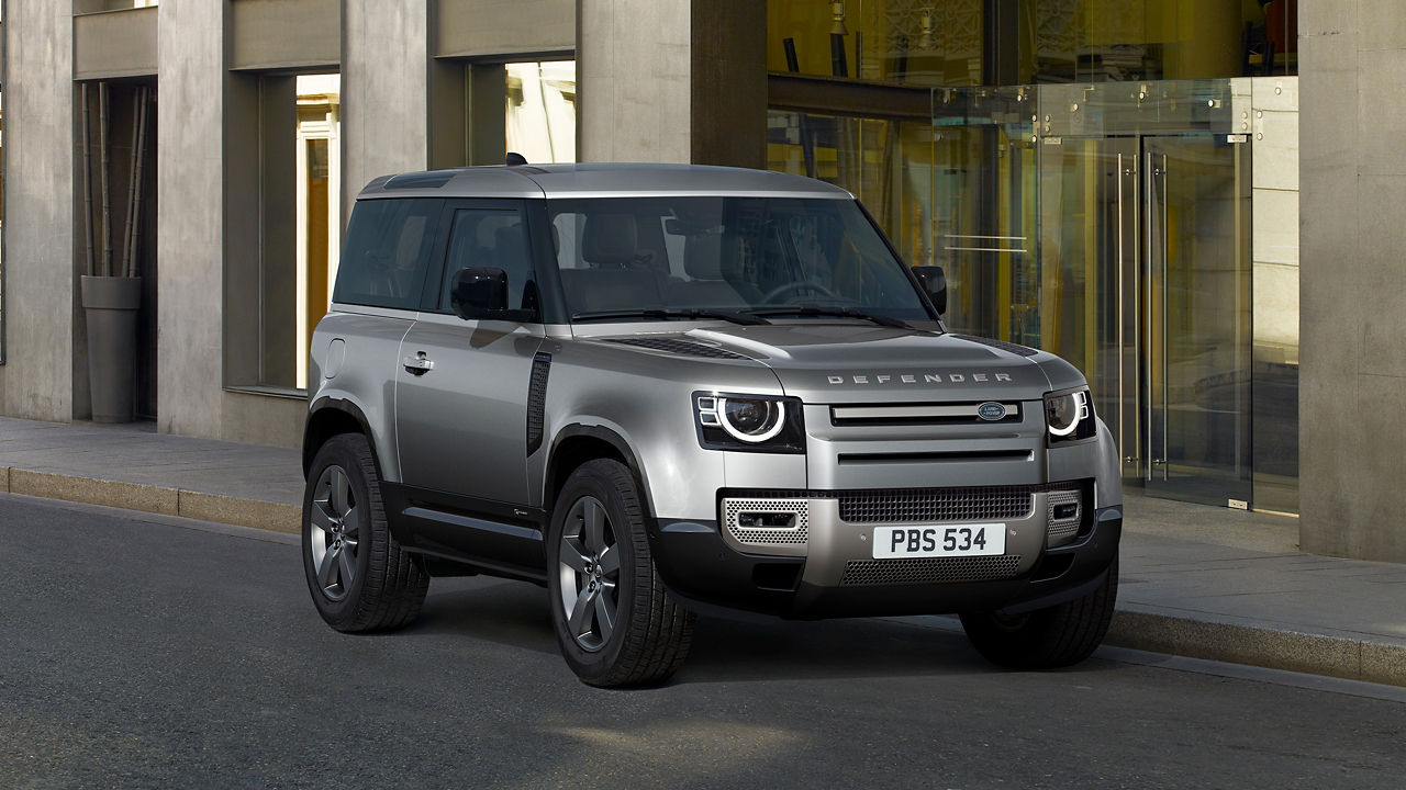 Parked Land Rover Defender outside of Restaurant