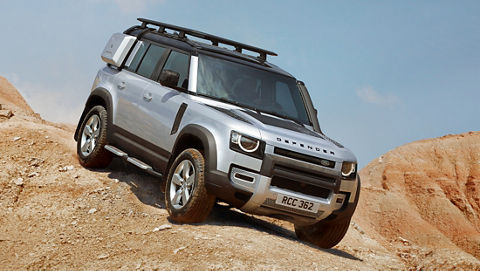 Defender driving on the hill
