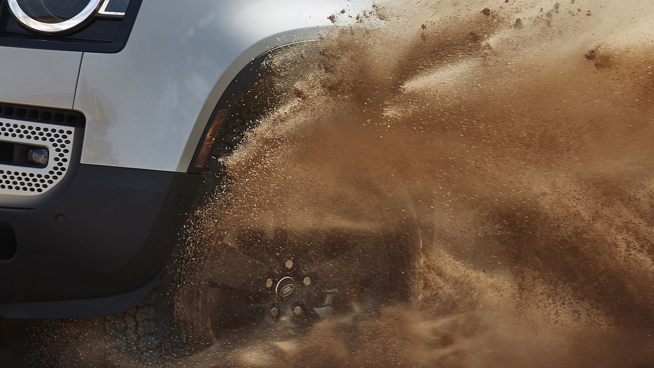 Defender Drifting Over Sand Dust Road