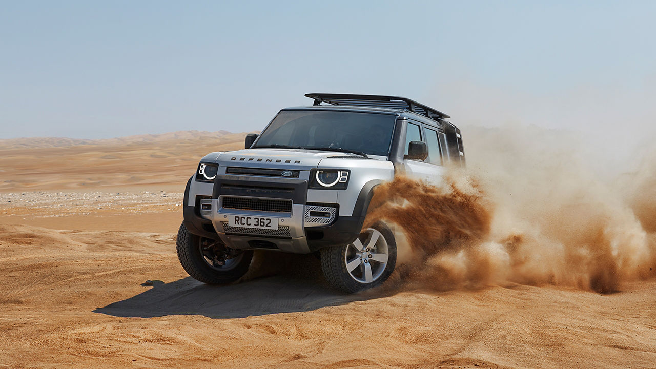 Defender Over Sand Dust Road