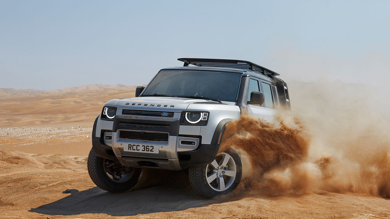 Defender Drifting Over Sand Dust Road