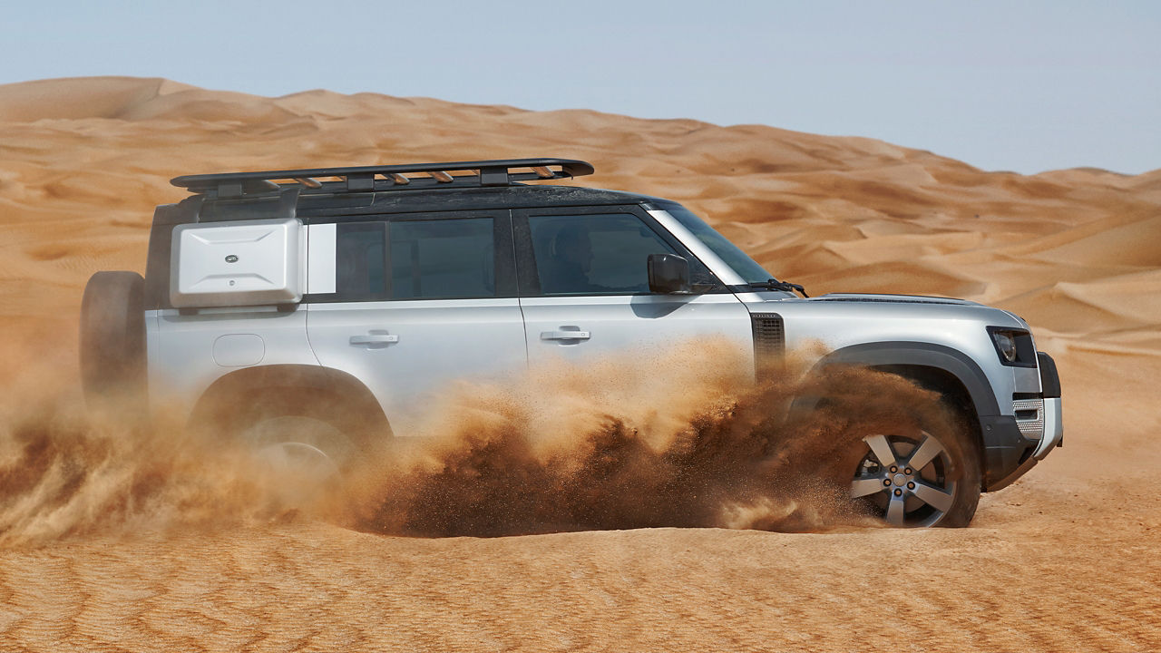 Land Rover Defender off-road driving in the desert