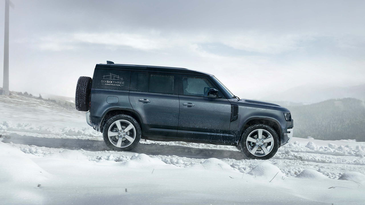 Defender driving in the snow