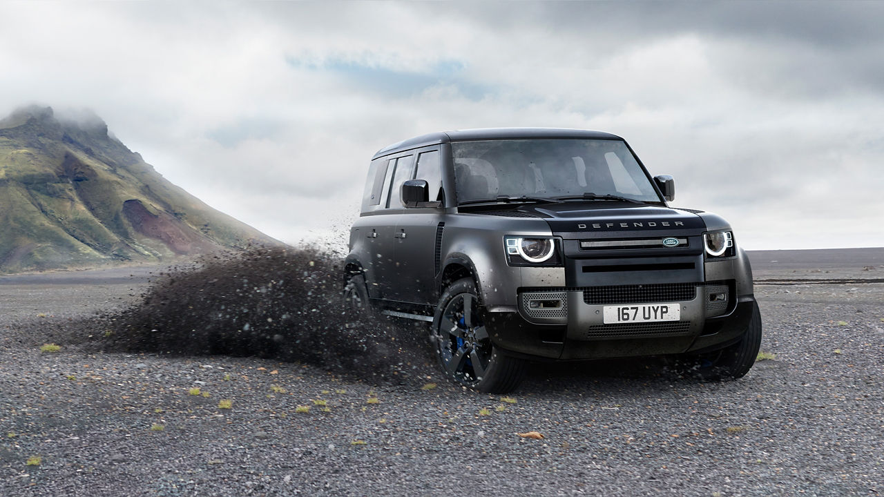 Defender Driving On Mountain Runway Road