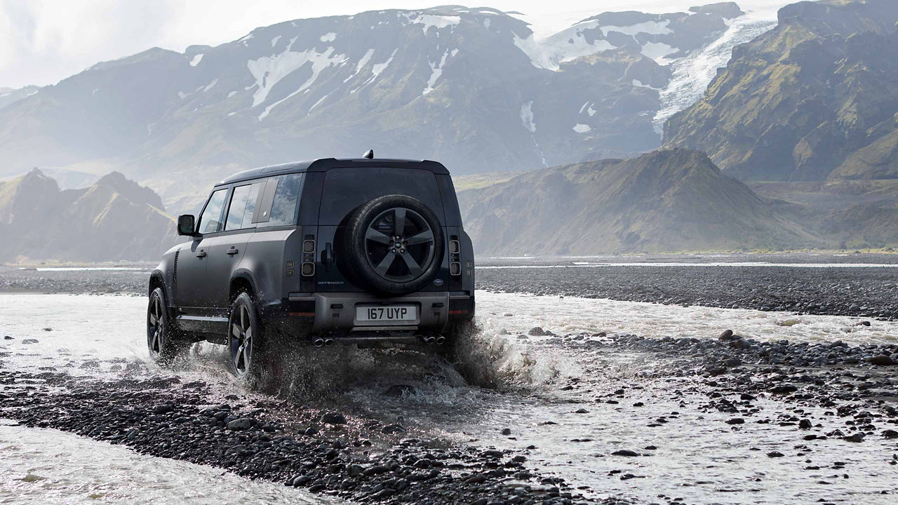 Range Rover Defender driving in water