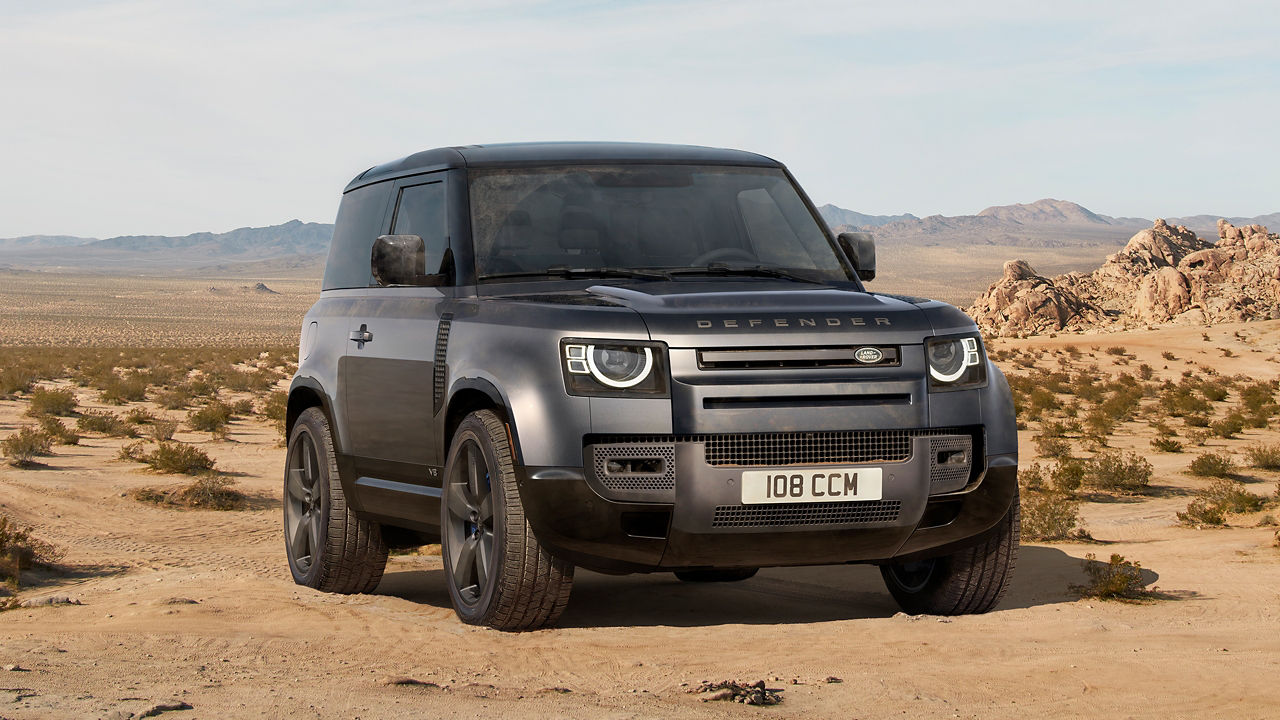 Defender Parked Over sand dust road