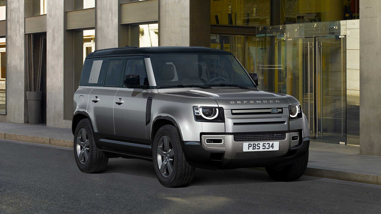 The Defender parked in front of a building