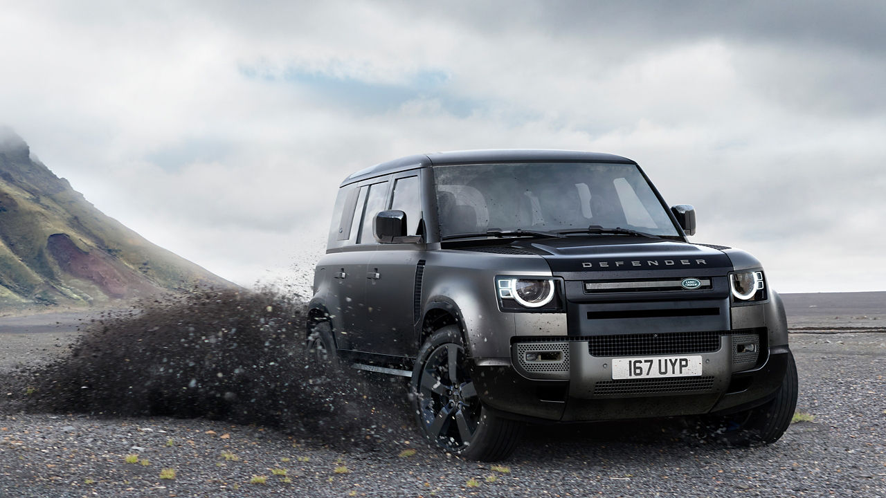 Defender driving on the sand