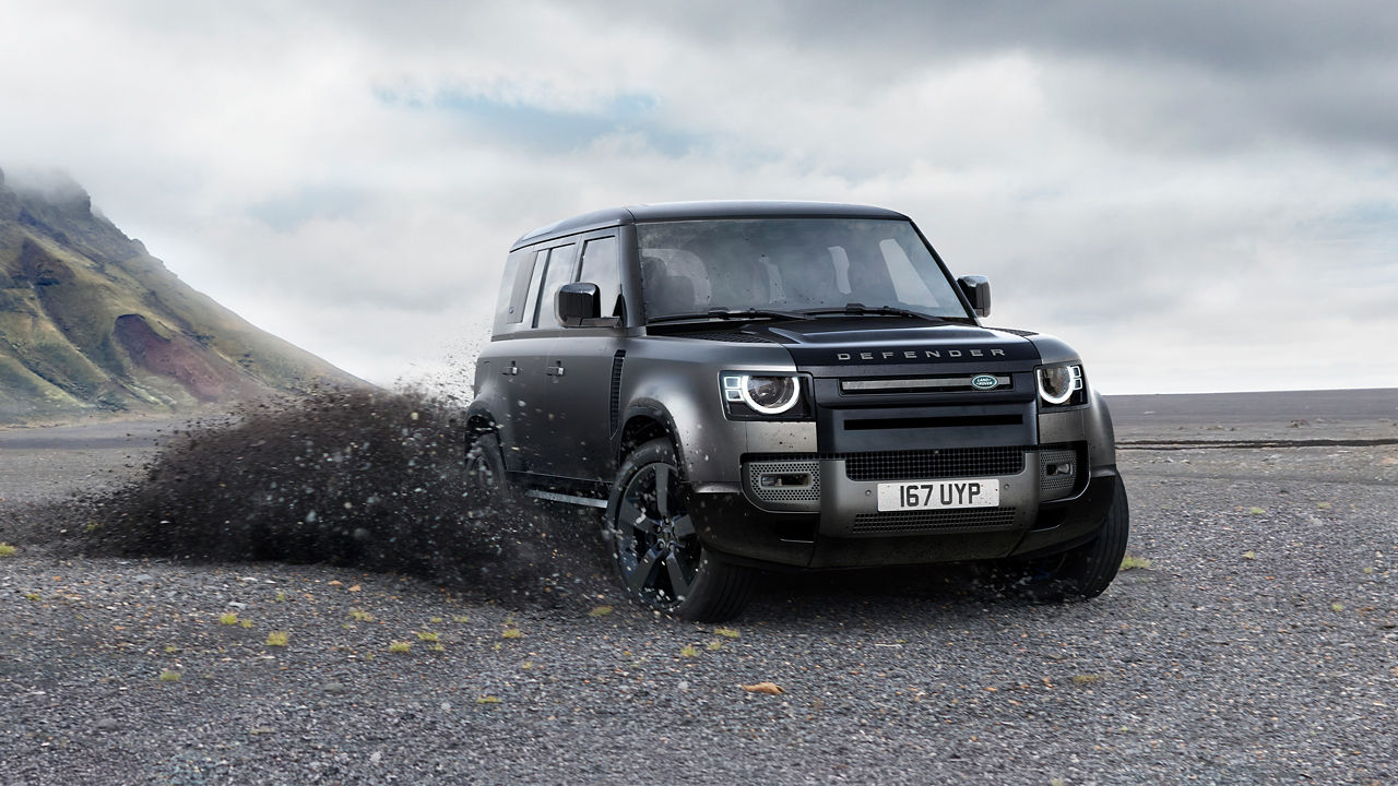 Defender driving on the sand