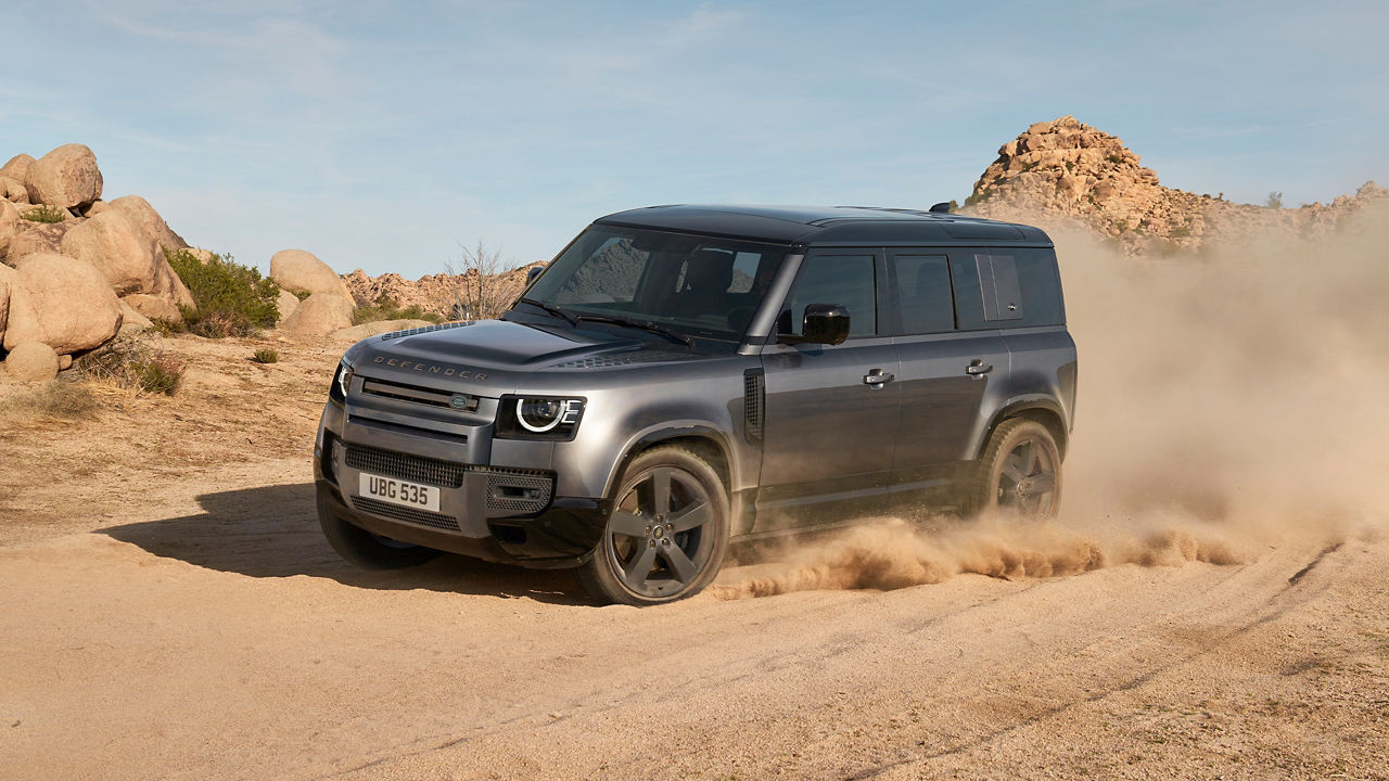 Range Rover Defender driving in the desert