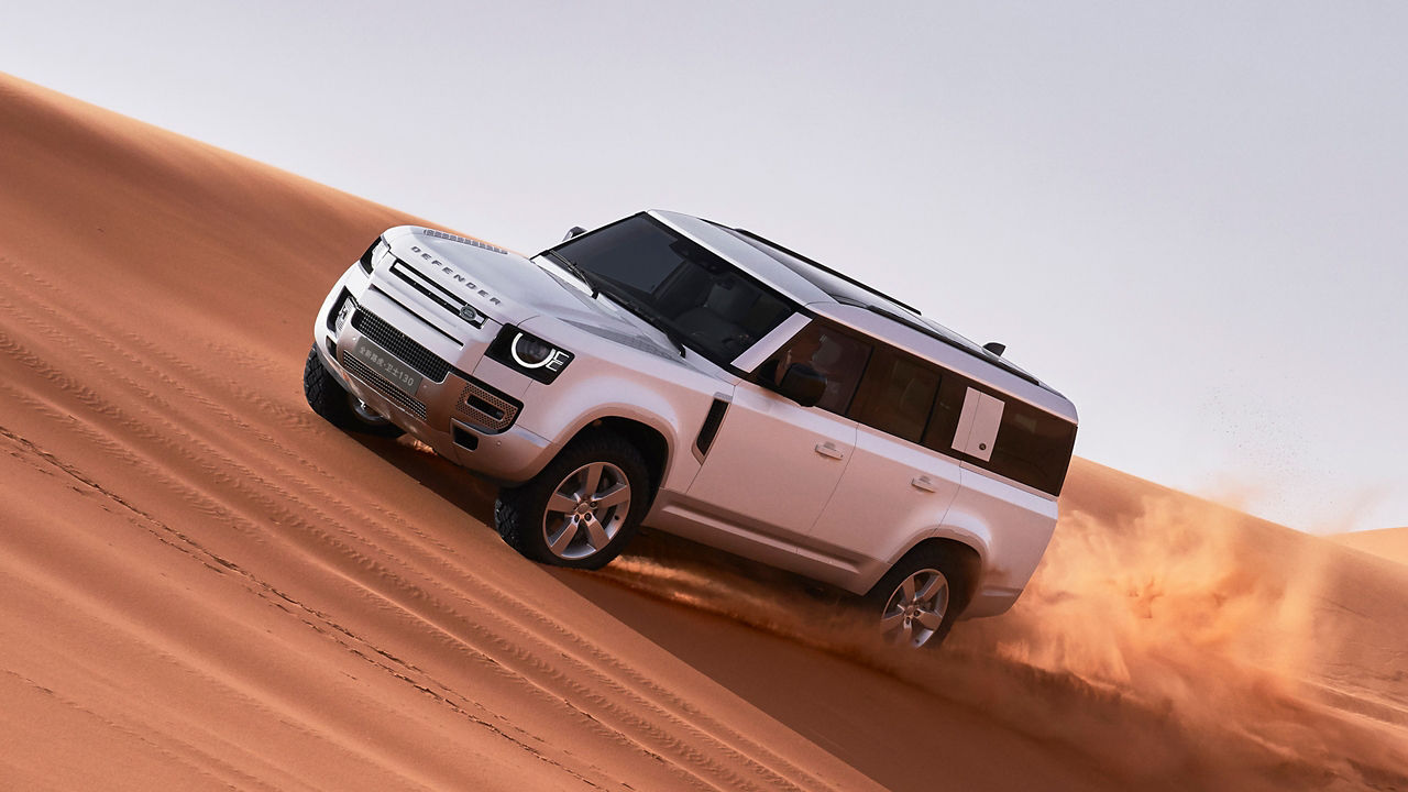 Defender Drifting Over Sand Dust Road