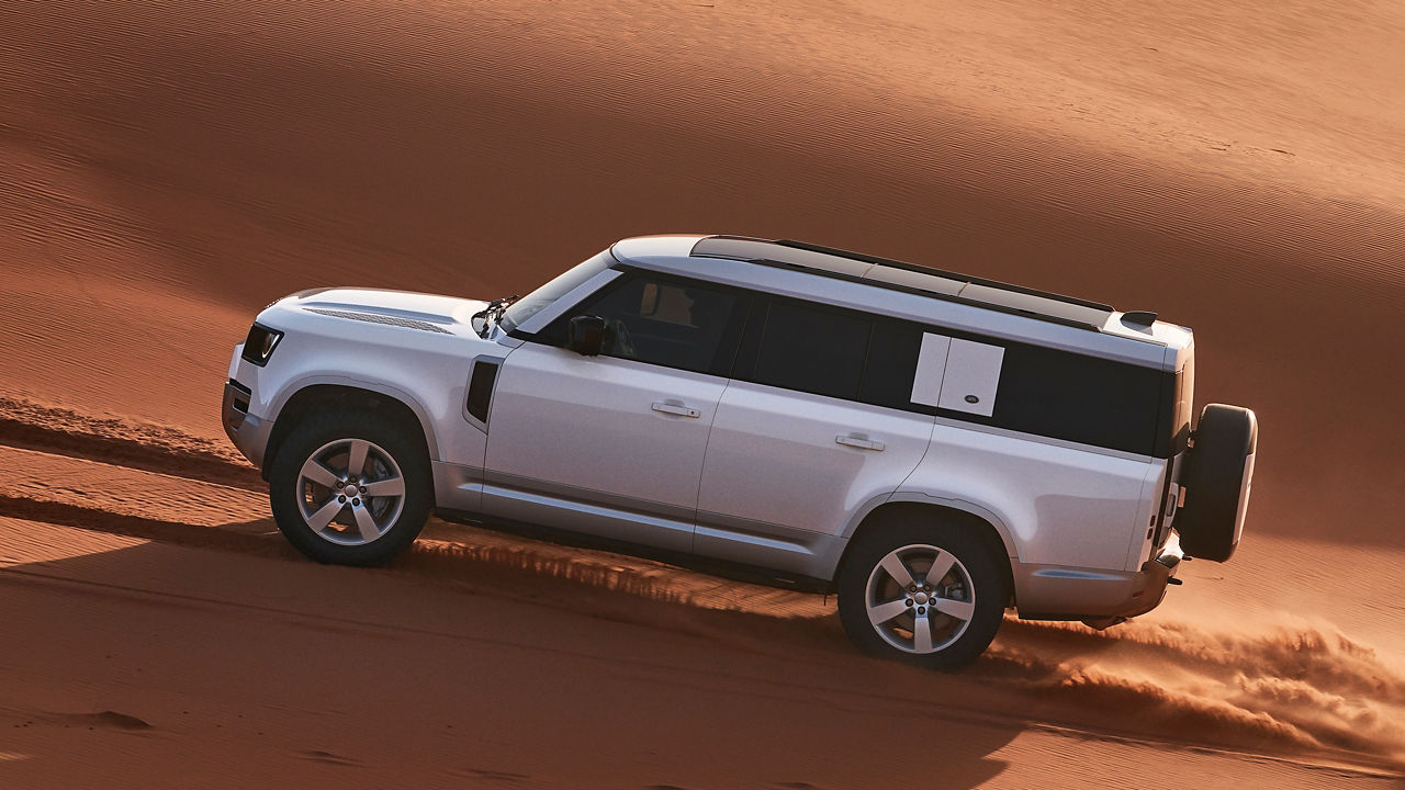 Defender Drifting Over Sand Dust Road