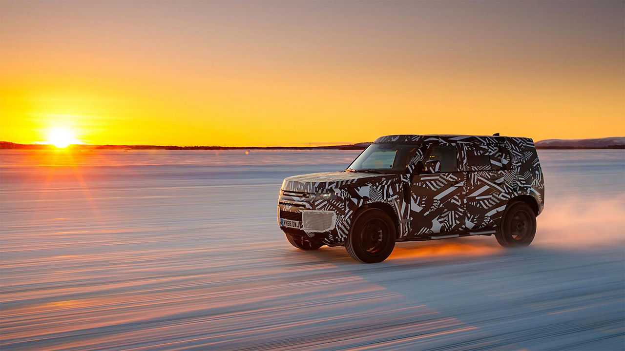Land Rover Defender crossing on a Snow Road