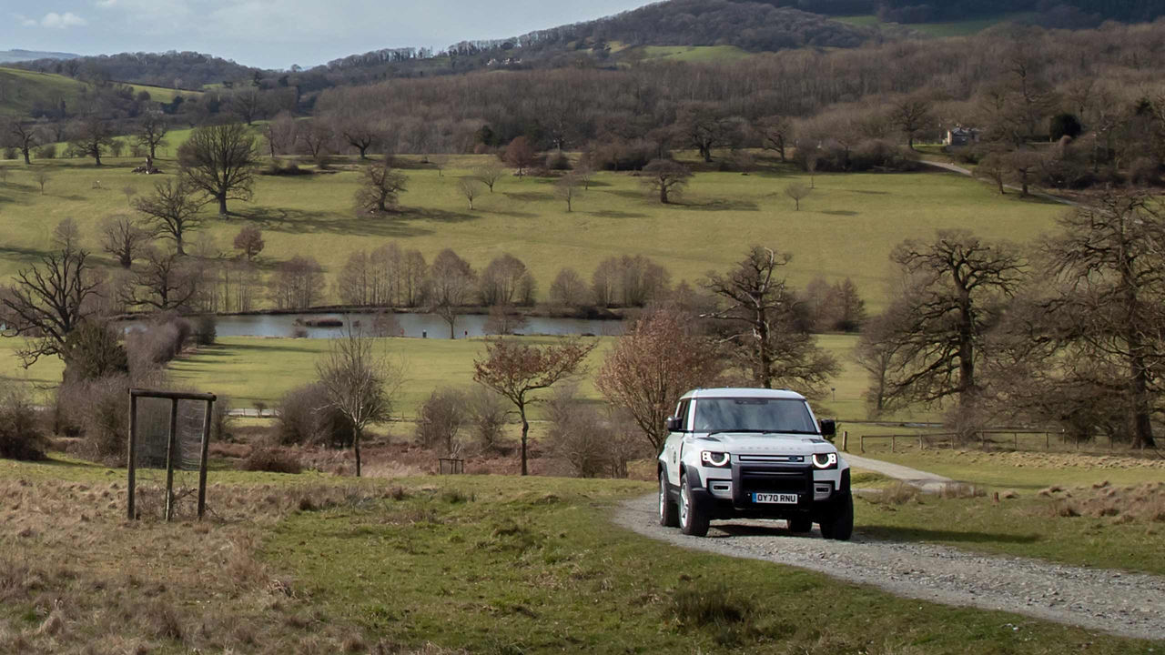 Defender running on the mountain road