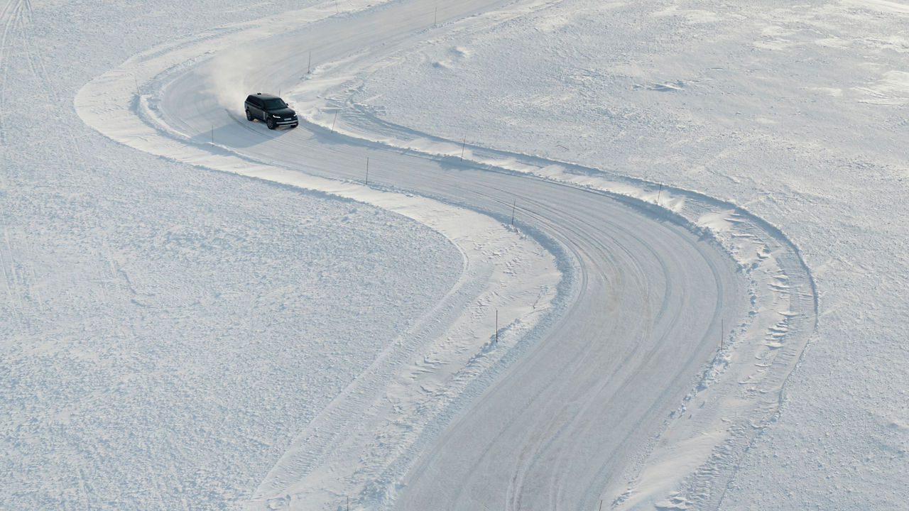 Range Rover Electric vehicle driving on snow.