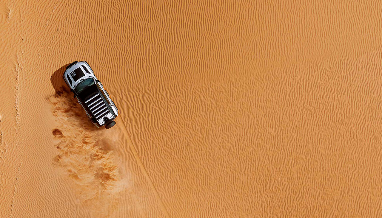 car in sand