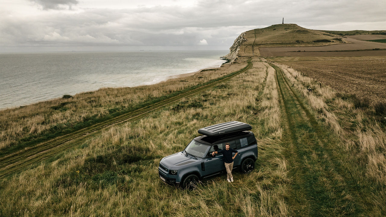 Defender on grassy land