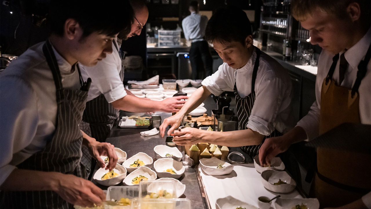 Chef's preparing dish in restaurant