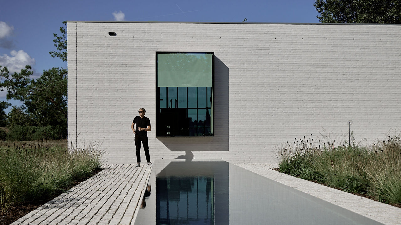 Man standing near swimming pool