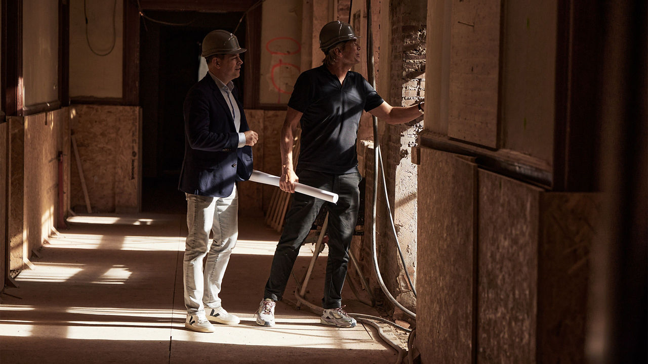 Two men looking over construction site