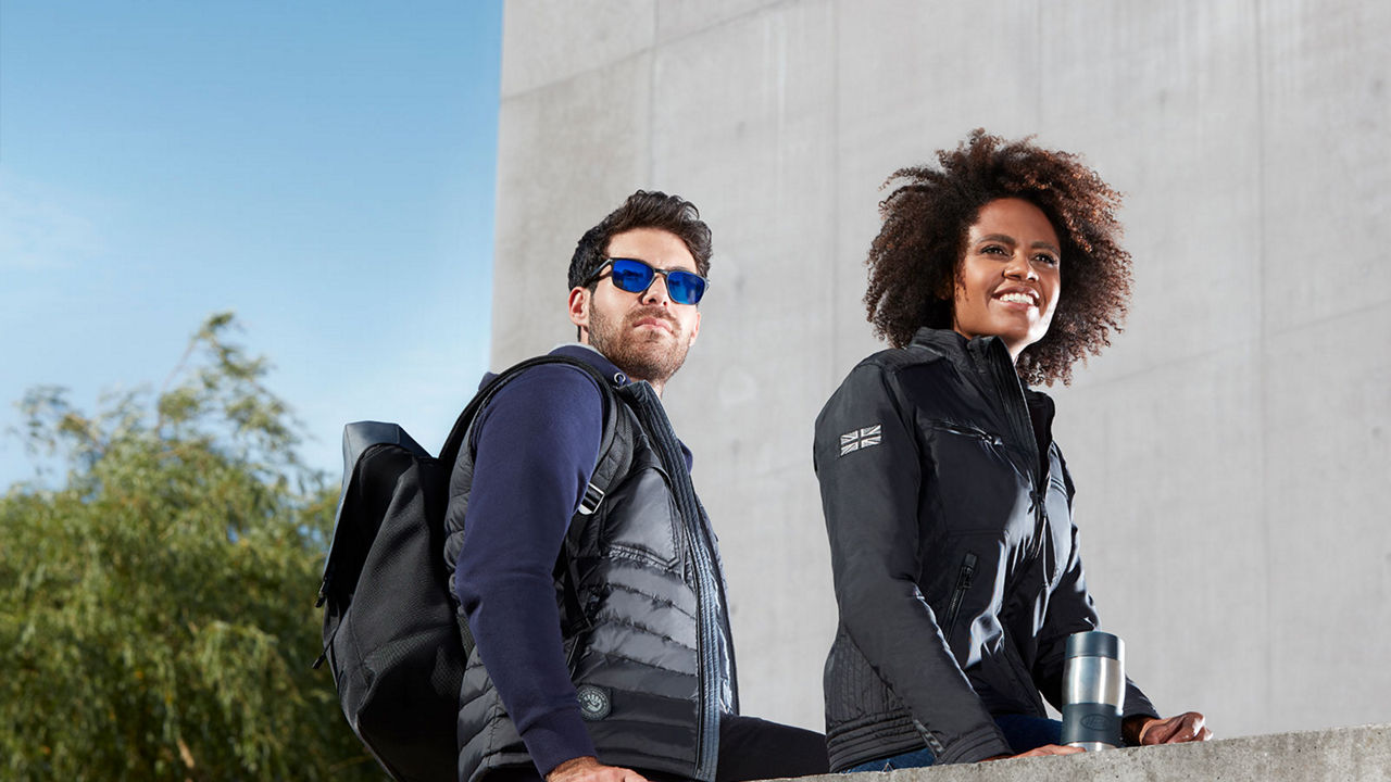 Man and woman wearing branded goods