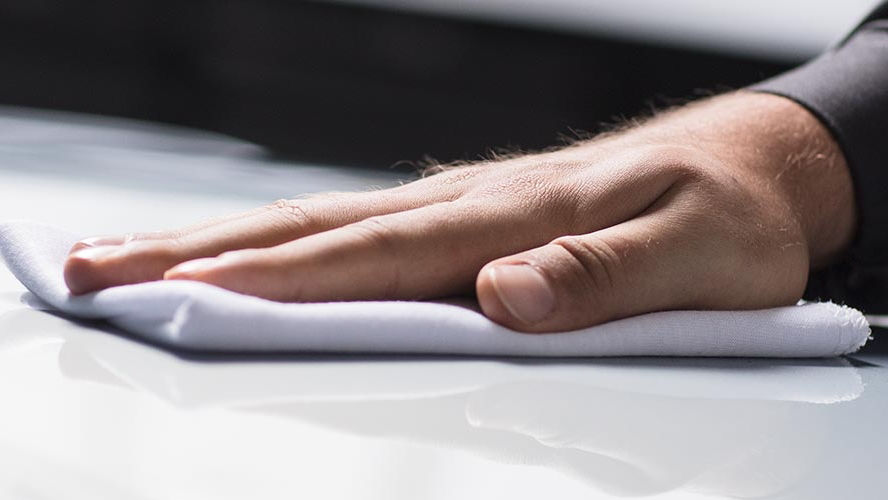 Close-up of a hand holding a cloth