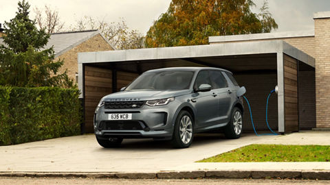 Parked Discovery in front of home and charged