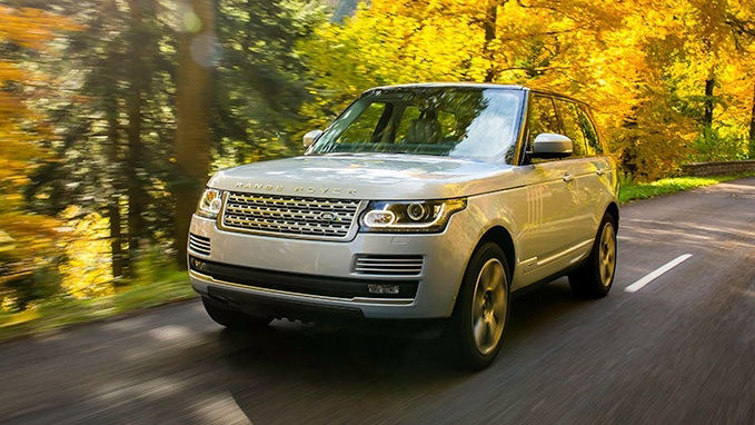 Range Rover driving on a forest road