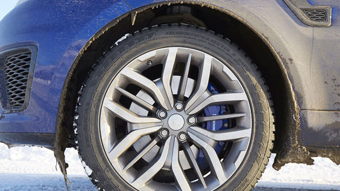 Close up of Range Rover Sport SVR wheel in snow