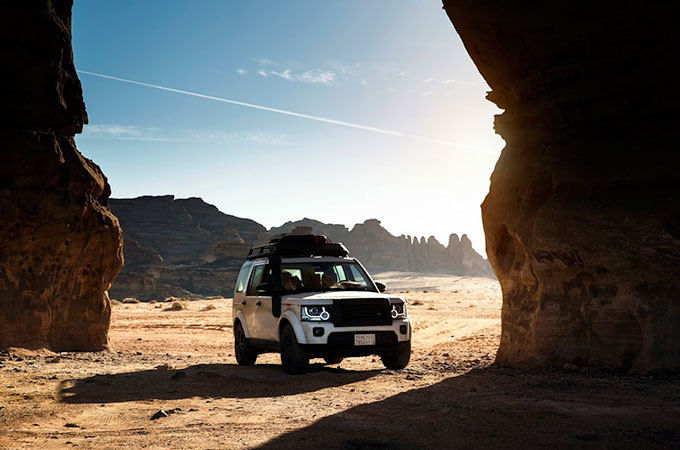 Land Rover parked in desert 