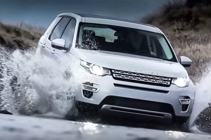 Land Rover Discovery driving through water